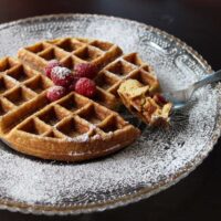 waffle topped with fresh raspberry